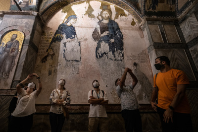 Tourists visit The Chora (Kariye) Church Museum, the 11th century church of St. Savior on August 21, 2020, in Istanbul, Turkey. The Chora Church Museum dates back to the Byzantine era when it was originally built as a monastery, during the Ottoman era it was converted into a mosque before being changed to a museum in 1948. The interior is decorated with some of the oldest surviving Byzantine mosaics and frescoes. 