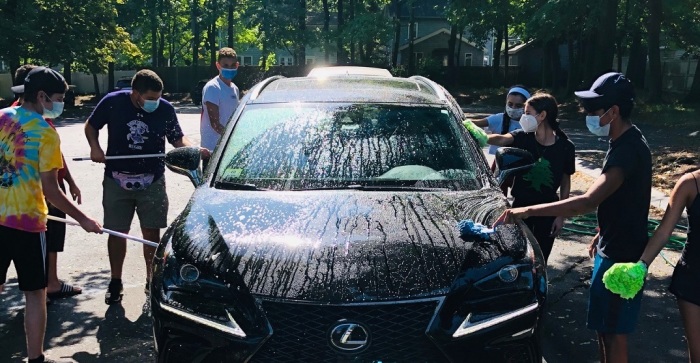 Members of St. George Orthodox Church of Boston, Massachusetts, hold a car wash on Aug. 22, 2020, to benefit the victims of the explosion in Beirut, Lebanon. 