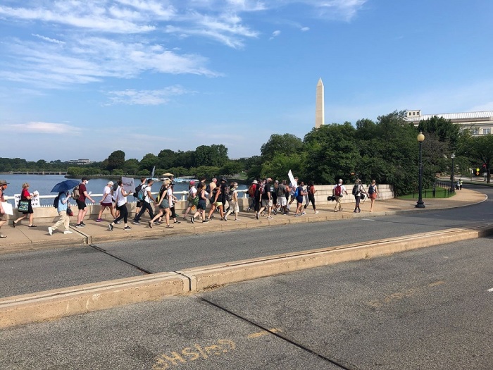 Participants in Walk the Walk 2020, a 130-mile pilgrimage from Charlottesville to Washington, march down to the National Mall in Washington D.C. for the Get Your Knee Off Our Necks Commitment March on Aug. 28, 2020. 