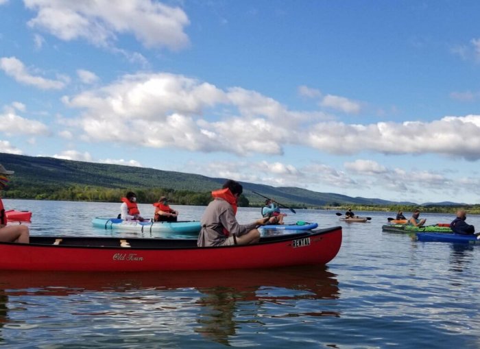 Faith United Church of Christ members in kayaks and canoes in the reservoir at Bald Eagle State Park.