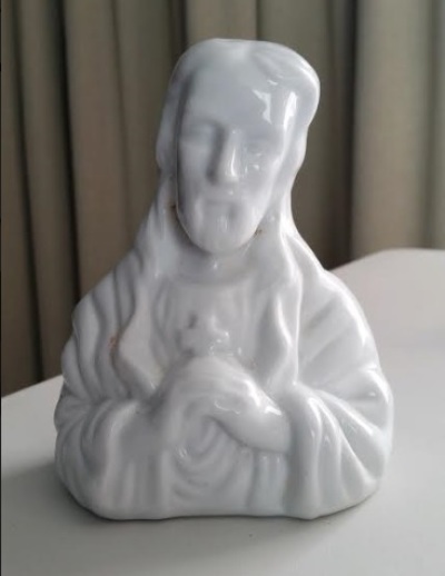 A porcelain figurine of Jesus recovered from the burned-down home of Dan and Rochelle Kelly in September 2020. 