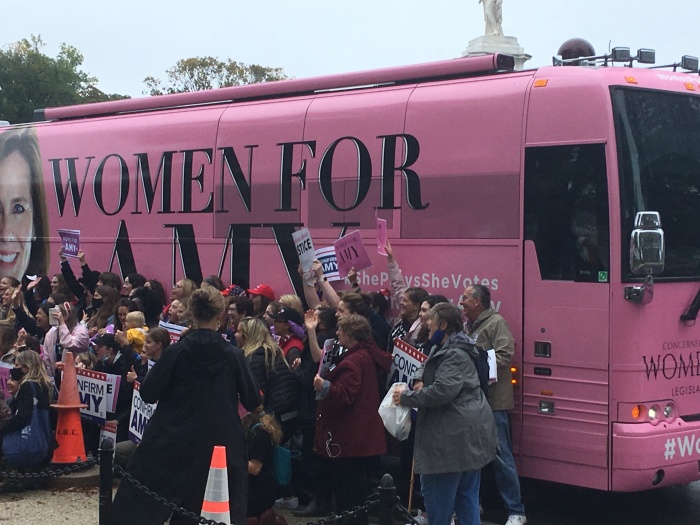 Members of Concerned Women for America chapters pose in front of the 'Women for Amy' tour bus in Washington D.C. on Oct. 12, 2020.