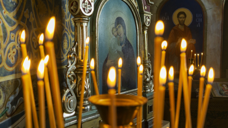  Candles burn in an orthodox church.