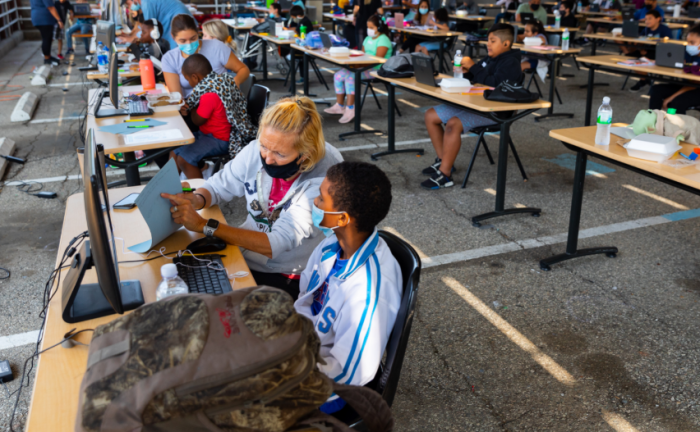 Tutors assist students with schoolwork at the Restart Learning Center, a distance learning center set up by the Los Angeles Dream Center, a faith-based nonprofit organization based in the Echo Park neighborhood of Los Angeles, 2020.