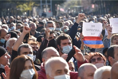 People protest during a rally against the country's agreement to end fighting with Azerbaijan over the disputed Nagorno-Karabakh region outside the government headquarters in Yerevan, Armenia on Nov. 11, 2020. More than 2,000 demonstrators protested in the Armenian capital as anger mounted over Prime Minister Nikol Pashinyan's decision to cede swathes of disputed territory to Azerbaijan under a controversial peace deal. 