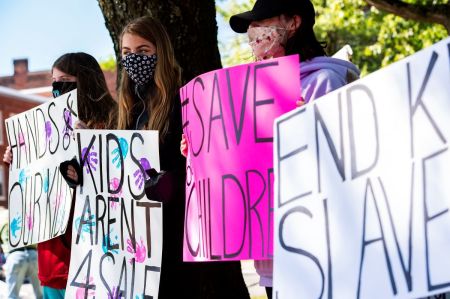 Demonstrators in Keene, New Hampshire, gather at a 'Save the Children Rally' to protest child sex trafficking and pedophilia around the world, on September 19, 2020. 