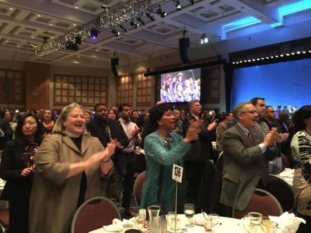 Rev. Canon Peg Chemberlin, Minnesota Council of Churches supporter Reatha Clark King, and United Methodist Bishop Bruce Ough at the Minnesota Council of Churches' table at the Rev. Dr. Martin Luther King Jr breakfast in Minneapolis in January 2016.