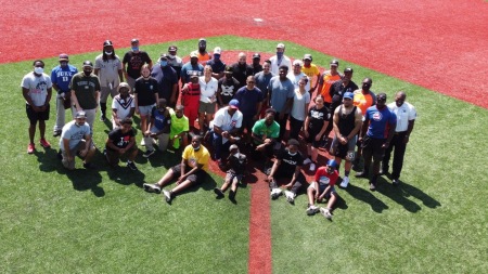 Coaches at City of Refuge pose on the field 