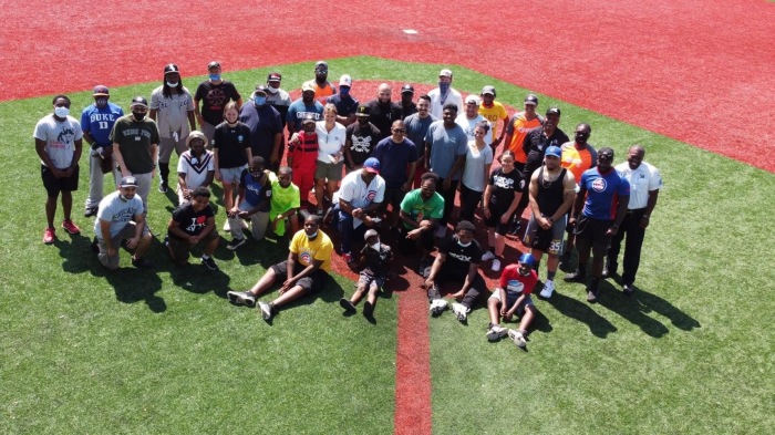 Coaches at City of Refuge pose on the field 