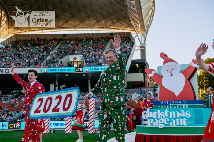 Two men in costumes participate in the National Pharmacies Christmas Pageant.