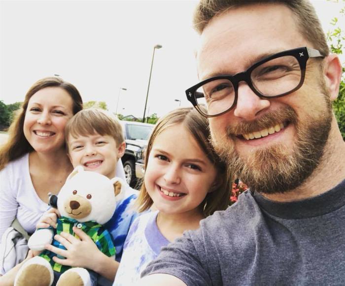 The late Pastor Matthew Netzer (R) and his family.