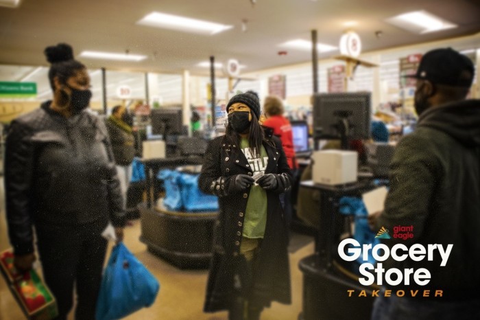 Members of Macedonia Church of Pittsburgh hand out gift cards to employees and help pay the bills of customers at a local Giant Eagle, Jan. 23, 2021.