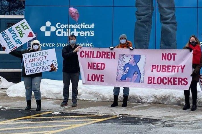 Protesters demonstrate against transing children outside Connecticut Children's Hospital in Hartford, Conn., on Feb. 14, 2021. 