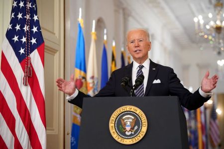 U.S. President Joe Biden gestures as he speaks on the anniversary of the start of the COVID-19 pandemic, in the East Room of the White House in Washington, D.C. on March 11, 2021. 