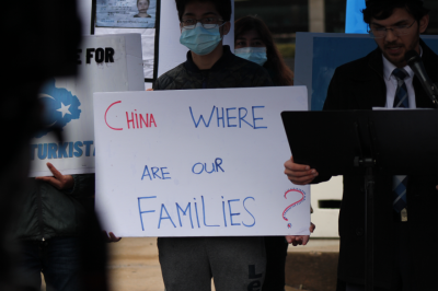 A protester holds a sign as Salih Hudayar, prime minister of the East Turkistan Government in Exile, addresses a crowd demonstrating against human rights abuses in China in front of the U.S. State Department, March 18, 2021.