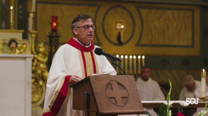 Santa Clara University President Father Kevin O'Brien speaks during an event honoring St. Ignatius of Loyola, the Society of Jesus's founder, on July 31, 2019. 