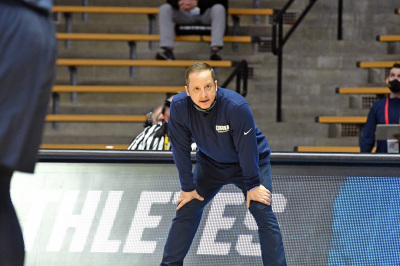 ORU Coach Paul Mills coaches the Golden Eagles from the sidelines during the NCAA Men's Basketball Tournament in 2021. 