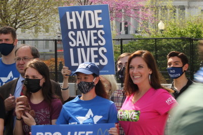 Speakers at the Democrats for Life of America's Save Hyde National Day of Action pose for a group photo in Washington, D.C., with the U.S. Capitol Building in the background on Apr. 10, 2021. From left to right: Catholic University of America Michael New, pro-life activist Purity Thomas, DFLA Executive Director Kristen Day and Americans United for Life President and CEO Catherine Glenn Foster.