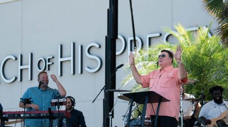 The Rev. John A. Kilpatrick (podium) leads the Church of His Presence in Daphne, Alabama.