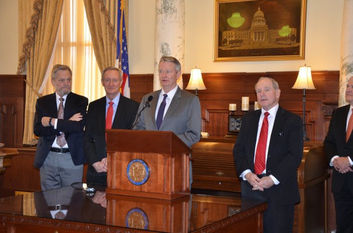 Idaho Gov. Brad Little (podium).