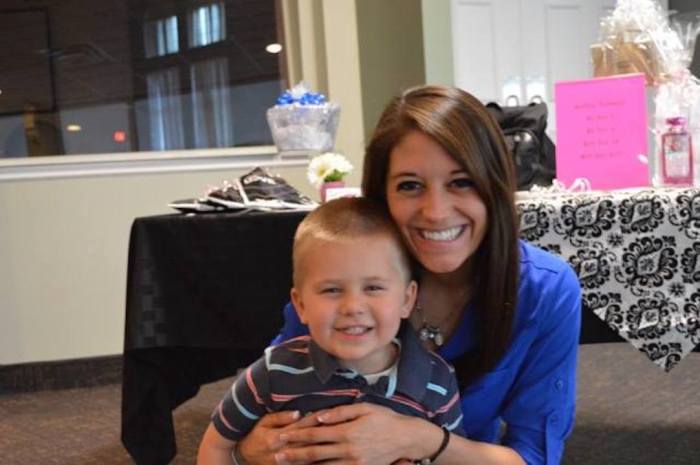 Birth mother Stephanie Studt hugs her son, Jeremiah, who was adopted. 