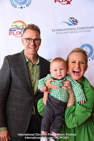 Jim E. Chandler, Jenn Gotzon and their son James on the red carpet at the International Christian Film and Music Festival, May 22, 2021