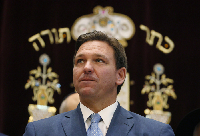 Florida Gov. Ron DeSantis attends a press conference at the Shul of Bal Harbour on June 14, 2021, in Surfside, Florida. The governor spoke about the two bills he signed HB 529 and HB 805. HB 805 ensures that volunteer ambulance services, including Hatzalah, can operate. HB 529 requires Florida schools to hold a daily moment of silence. 