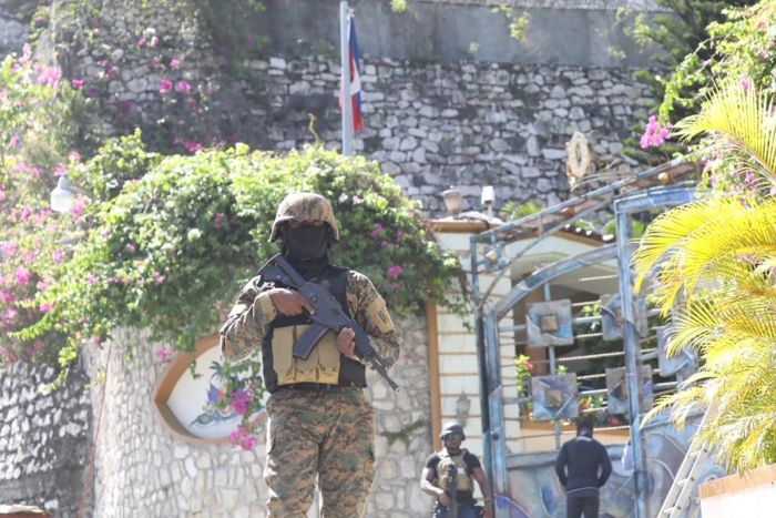 Members of the Haitian police and forensics patrol the area as they look for evidence outside of the presidential residence on July 7, 2021 in Port-au-Prince, Haiti, after Haiti President Jovenel Moise was assassinated and his wife wounded in an attack at their home. 