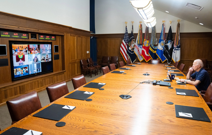 In this White House handout, U.S. President Joe Biden and Vice President Kamala Harris (on screen) hold a video conference with the national security team to discuss the evacuation in Afghanistan on August 16, 2021, at Camp David in Frederick County, Maryland. 