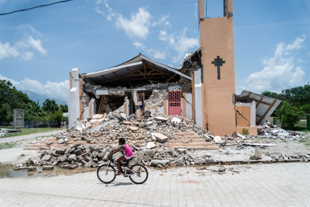 The Church St. Anne is seen completely destroyed by the earthquake in Chardonnieres, Haiti on August 18, 2021. The death toll from a 7.2 magnitude earthquake that struck Haiti has risen to more than 2,100, the Caribbean nation's civil protection agency said Wednesday, as a tropical storm brought torrential downpours on survivors already coping with catastrophe. More than 12,000 people were wounded when the quake struck the southwestern part of the Caribbean nation on Saturday, about 100 miles (160 kilometers) to the west of the capital Port-au-Prince, according to the updated toll. 