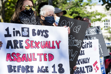 Demonstrators in Keene, New Hampshire, gather at a 'Save the Children Rally' to protest child sex trafficking and pedophilia around the world, on September 19, 2020. 