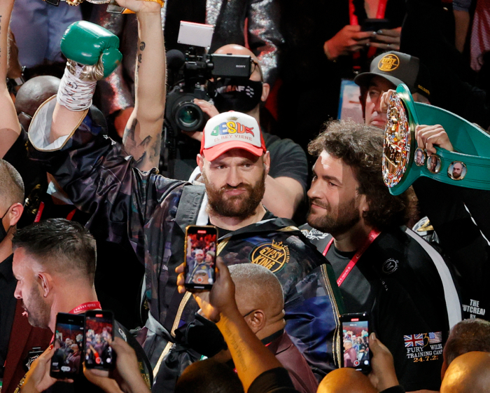 Tyson Fury (L) and his brother Shane Fury walk to the ring for Tyson Fury's WBC heavyweight title fight against Deontay Wilder at T-Mobile Arena on October 9, 2021, in Las Vegas, Nevada. Fury retained his title with an 11th-round knockout