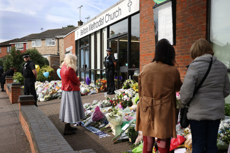 Well wishers visit Belfairs Methodist Church to pay their respects on October 18, 2021, in Leigh-on-Sea, England. Sir David Amess, MP for Southend West, was stabbed to death while meeting with constituents in Leigh-on-Sea on Friday at Belfairs Church. A 25-year-old man, Ali Harbi Ali, was arrested at the scene and the attack is being treated by police as a terrorist incident.