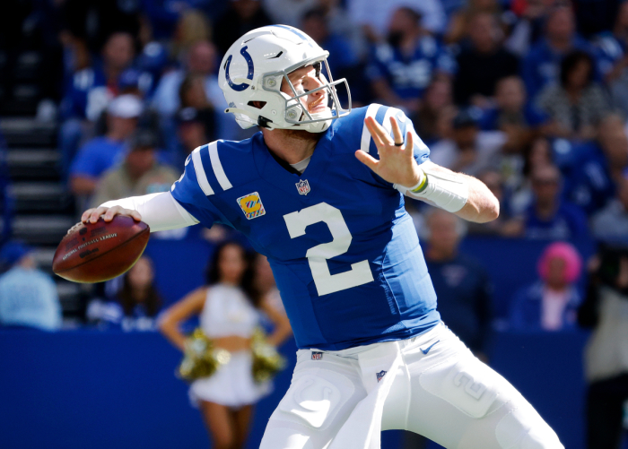 Carson Wentz of the Indianapolis Colts looks to throw a pass against the Houston Texans in the first half at Lucas Oil Stadium on October 17, 2021 in Indianapolis, Indiana. 