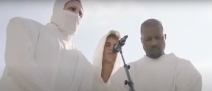 Singer Marilyn Manson (left) appears on stage with fellow musicians Justin Bieber (center) and Kanye West (right) at West's Sunday Service, Oct. 31, 2021.