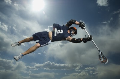 Low angle view of jai-alai player jumping.