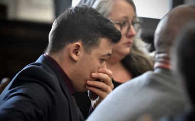 Kyle Rittenhouse puts his hand over his face as he is found not guilty on all counts at the Kenosha County Courthouse on November 19, 2021 in Kenosha, Wisconsin.Sean Krajacic - Pool/Getty Images) 