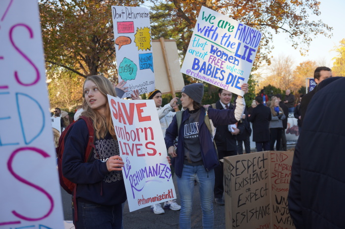 Jordan from Oklahoma stood with a pro-life posters, among other demonstrators expressing themselves outside the U.S. Supreme Court building in Washington, D.C. on Dec. 1, 2021.