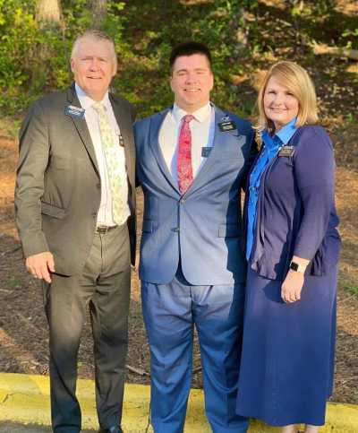 Latter Day-Saint Elder Michael Fauber, 18 (C), is pictured with his parents.