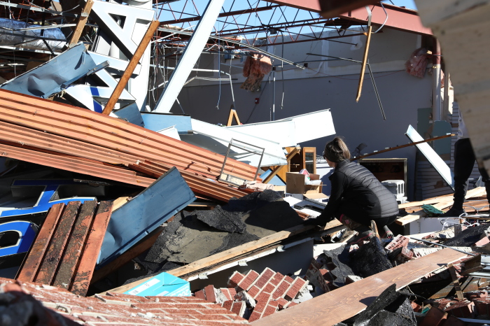 A volunteer with Samaritan's Purse participates in a relief effort following a deadly tornado in Mayfield, Kentucky, in December 2021. A series of deadly tornadoes hit six states, killing dozens on Dec. 10 and Dec. 11.