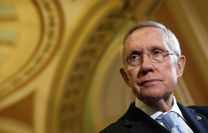 Then Senate Majority Leader Harry Reid, D-Nev., answers questions following the weekly Democratic policy luncheon at the U.S. Capitol September 16, 2014, in Washington, D.C. 