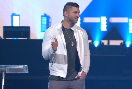 Tim Tebow speaks at Passion 2022 at Mercedes-Benz Stadium in Atlanta, Georgia on Jan. 2, 2022. 