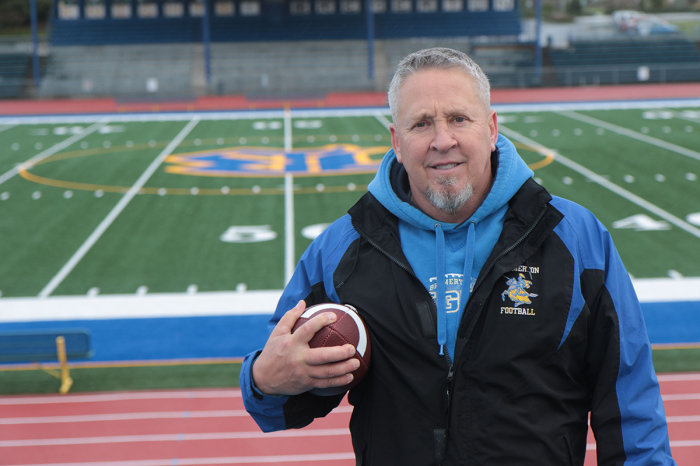 Coach Kennedy at the Bremerton High School football field. 