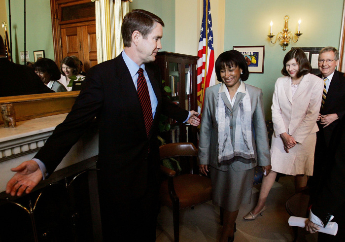 (L-R) U.S. Senate Majority Leader Bill Frist, R-Tenn., leads the way for judicial nominees Janice Rogers Brown and Priscilla Owens following a meeting and photo opportunity in Frist's office at the U.S. Capitol May 17, 2005, in Washington, D.C. Senate Republicans have vowed to change the Senate rules if necessary to break the logjam of judicial nominees sent for confirmation by U.S. President George W. Bush. 