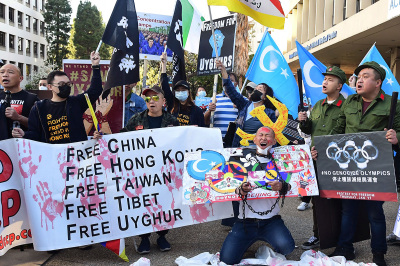 Activists protest against the 2022 Beijing Winter Olympics outside the Consulate of China in Los Angeles, California, on February 3, 2022. Activists protested against the many human rights abuses of the Chinese Communist Party and called for a boycott of the 2022 Winter Olympics in Beijing. 