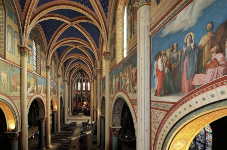 Churchgoers worship inside the restored interior of the Church of Saint Germain des Prés in Paris, France.