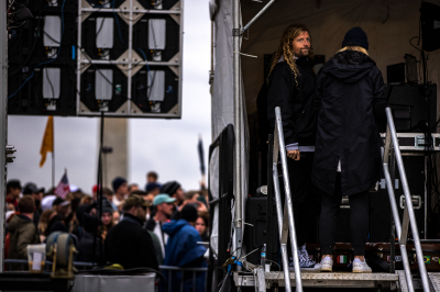 Evangelical musician Sean Feucht (2R) stands backstage as he prepares to host a concert on the National Mall on October 25, 2020, in Washington, D.C. Feucht was granted a permit to host the event by the National Park Service and the event violates the district's COVID-19 regulations on gatherings of more than 50 people. Despite the pandemic, attendees did not follow social distancing or face covering guidelines established by the CDC. 