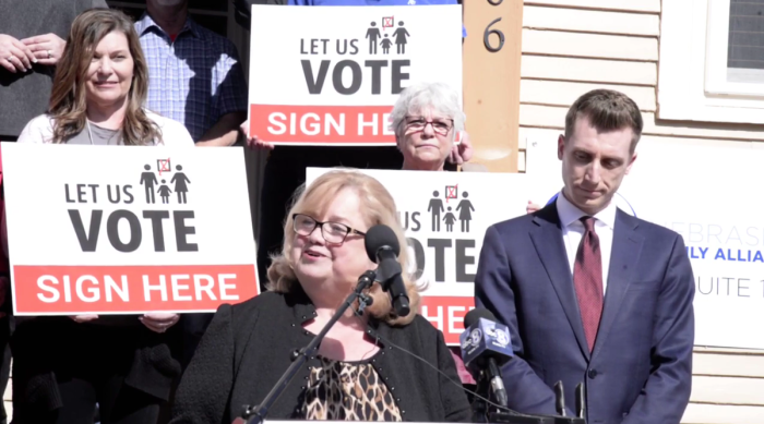 Nebraska Family Alliance Executive Director Karen Bowling (center) speaks during a press conference in Lincoln, Nebraska, on March 1, 2022. 