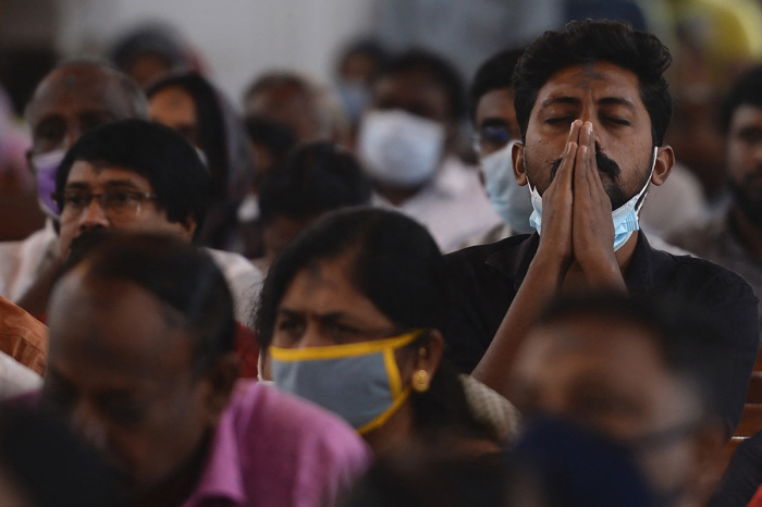 Catholic Christian devotees attend a holy mass during an Ash Wednesday service at St. Thomas Cathedral Basilica in Chennai on March 2, 2022. 