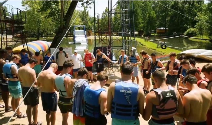 Campers and staff gather in prayer a Kanakuk camp in this undated file photo.